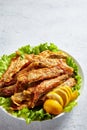 Fried small capelins on a white plate Royalty Free Stock Photo