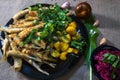 Fried smelt with potatoes on a plate