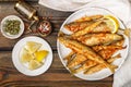 Fried smelt in a white plate. Small fish