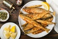 Fried smelt in a white plate. Small fish