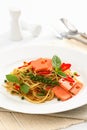 Fried Spaghetti with ham and sausage, Spicy fusion Thai food Royalty Free Stock Photo