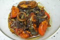 Fried Spanish mackerels fish cooked with black soy sauce.
