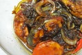 Fried Spanish mackerels fish cooked with black soy sauce.