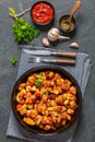 fried spanish potatoes with paprika sauce in bowl