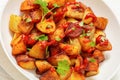 fried spanish potatoes with paprika sauce in bowl