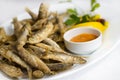 Fried sprat fish with souce Royalty Free Stock Photo