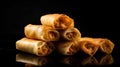 Fried spring rolls on a black background. Selective focus.