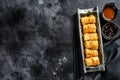 Fried spring rolls. Black background. Traditional Chinese cuisine. Top view. Copy space