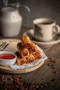 Fried Spring Rolls on a Rattan Plate with a Sweet Chilli Sauce and a Cup of Coffee. Malaysian Snacks. Malaysian Breakfast. Asian