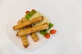 Fried spring rolls with red and white sauces. Deep fried spring roll with sauce on white plate. Crispy spring rolls on dish with v Royalty Free Stock Photo