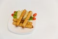 Fried spring rolls with red and white sauces. Deep fried spring roll with sauce on white plate. Crispy spring rolls on dish with v Royalty Free Stock Photo