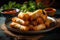 Fried spring rolls with sweet and sour sauce on dark background.