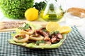 Fried squid with lettuce and lemon