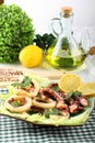 Fried squid with lettuce and lemon