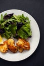 Fried squid with salad and lemon on white plate Royalty Free Stock Photo