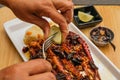 Fried squid tentacles with dried chili and garlic accompanied by white rice and rosemary