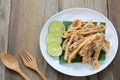 fried squid of Thai seafoods in the white dish on wood floor. Royalty Free Stock Photo