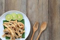 fried squid of Thai seafoods in the white dish on wood floor. Royalty Free Stock Photo