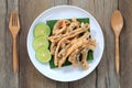 fried squid of Thai seafoods in the white dish on wood floor. Royalty Free Stock Photo