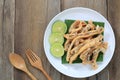 fried squid of Thai seafoods in the white dish on wood floor. Royalty Free Stock Photo