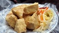 Fried stinky tofu with pickle vegetable and sauce on the side