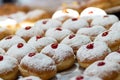 Fried and stuffed sufganiot with strawberry jam,