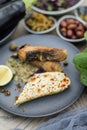 Fried Sturgeon Fish with Cheesy Baked Courgette and Caper Sauce Royalty Free Stock Photo