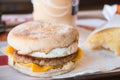 Fried sunnyside up egg on pork with a bagel and cheese Royalty Free Stock Photo