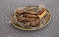Fried surmullet on table. fish fried in corn flour, served with lemon Royalty Free Stock Photo
