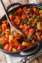 Fried sweet potato black bean chili close-up in a pan. vertical Royalty Free Stock Photo