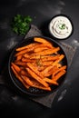 fried sweet potatoes with gravy. Selective focus.