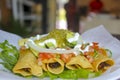 Fried Tacos in Spanish: Tacos Dorados. A Mexican food dish that typically consists of a small rolled-up tortilla that contains