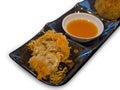 Fried Taro in black plate, die cut on white isolated