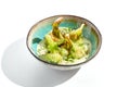 Fried tempura broccoli with peanut sauce in bowl. Vegeterian hot dish - florets cabbages roasted in klar on white background.