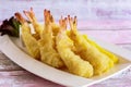 Fried TEMPURA PRAWNS served in dish isolated on table closeup top view of grilled seafood
