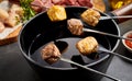 Fried tender beef, pork and veal over a fondue pot Royalty Free Stock Photo