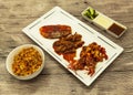Fried tiger prawns and octopus in a Chinese style grilled barbecue in a spicy oil with fried rice and sauces. Royalty Free Stock Photo