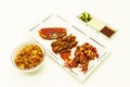 Fried tiger prawns and octopus in a Chinese style grilled barbecue in a spicy oil with fried rice and sauces. Royalty Free Stock Photo