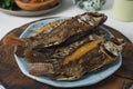 Fried Tilapia fish with cantella asiatica and hot and spicy sauce as side dish Royalty Free Stock Photo