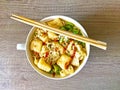 Fried Tofu spicy Asian Noodle soup with greens