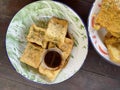 Fried tofu on a wooden table, this is a traditional Indonesian processed food Royalty Free Stock Photo