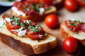 Fried tomatoes with cheese basil on toast baguettes bruschetta with gourmet oil.