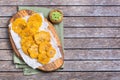 Fried tostones, green plantains, bananas with guacamole sauce Royalty Free Stock Photo