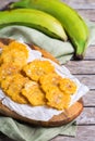 Fried tostones, green plantains, bananas with guacamole sauce