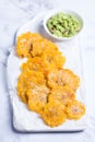 Fried tostones, green plantains, bananas with guacamole sauce Royalty Free Stock Photo