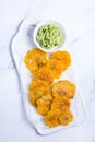 Fried tostones, green plantains, bananas with guacamole sauce Royalty Free Stock Photo