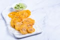 Fried tostones, green plantains, bananas with guacamole sauce Royalty Free Stock Photo