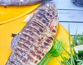 Fried trout grill on the table Royalty Free Stock Photo