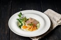 Fried Turkey meat steak, sunny side up egg, pasta, pesto sauce and vegetable salad on a white plate. Hot dishes from poultry meat Royalty Free Stock Photo