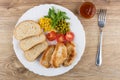 Fried turkey meat with vegetables, bread in dish, ketchup Royalty Free Stock Photo